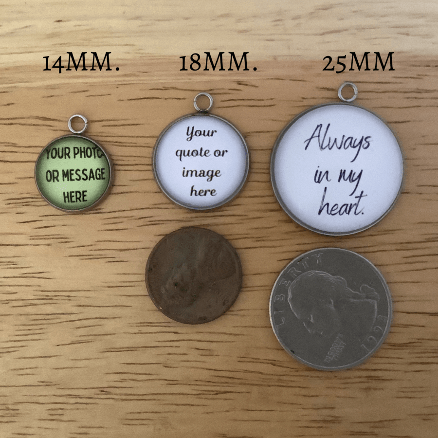 Sizing of the Charm sizes on a wooden surface with coins for scale.