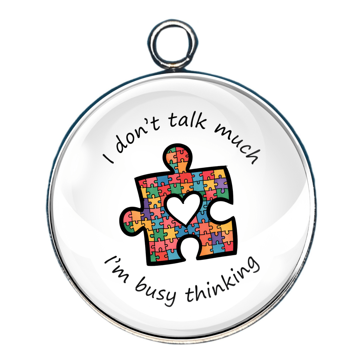 Charm of a rainbow puzzle piece with the wording ' i dont talk much, I'm busy thinking'