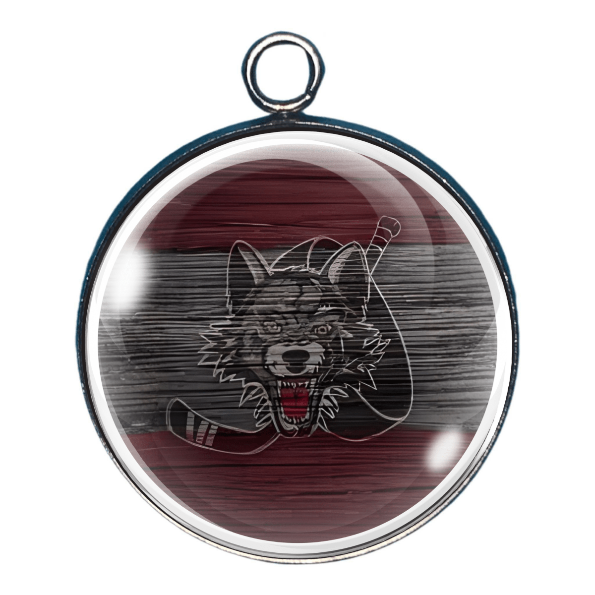 Charm with wolf design on a wooden background