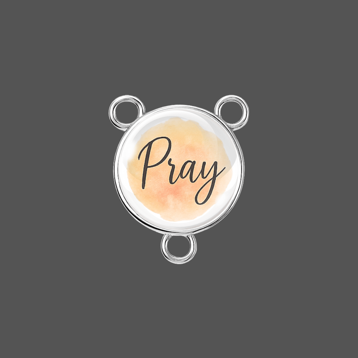 Round pendant with 'Pray' text on a watercolor background, silver frame