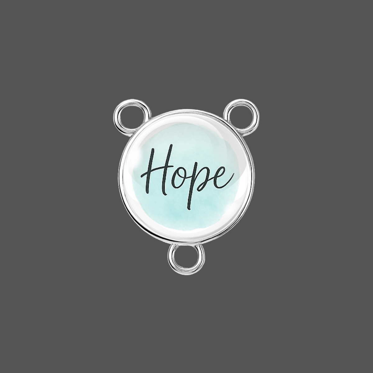 Round silver pendant with 'Hope' text on a light blue watercolor background
