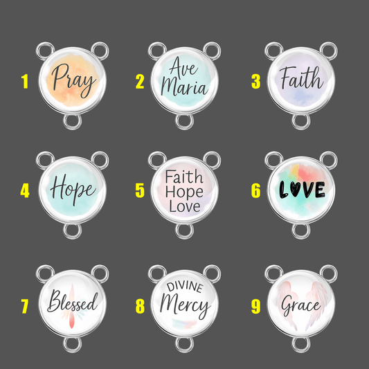 Set of 9 Tibetan silver rosary centers with 18 mm watercolor inspirational words including Pray, Faith, Ave Maria, Hope, Divine Mercy, Blessed, and Grace under clear glass cabochons.