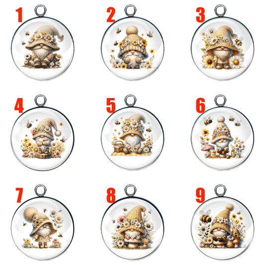 “Spring Bumble Bee Gnome Charm Collection – 9 adorable handcrafted glass cabochon charms featuring whimsical gnomes with bees, flowers, and spring-themed props. Each design is numbered for selection and set in a round stainless steel base, available in silver or gold.”