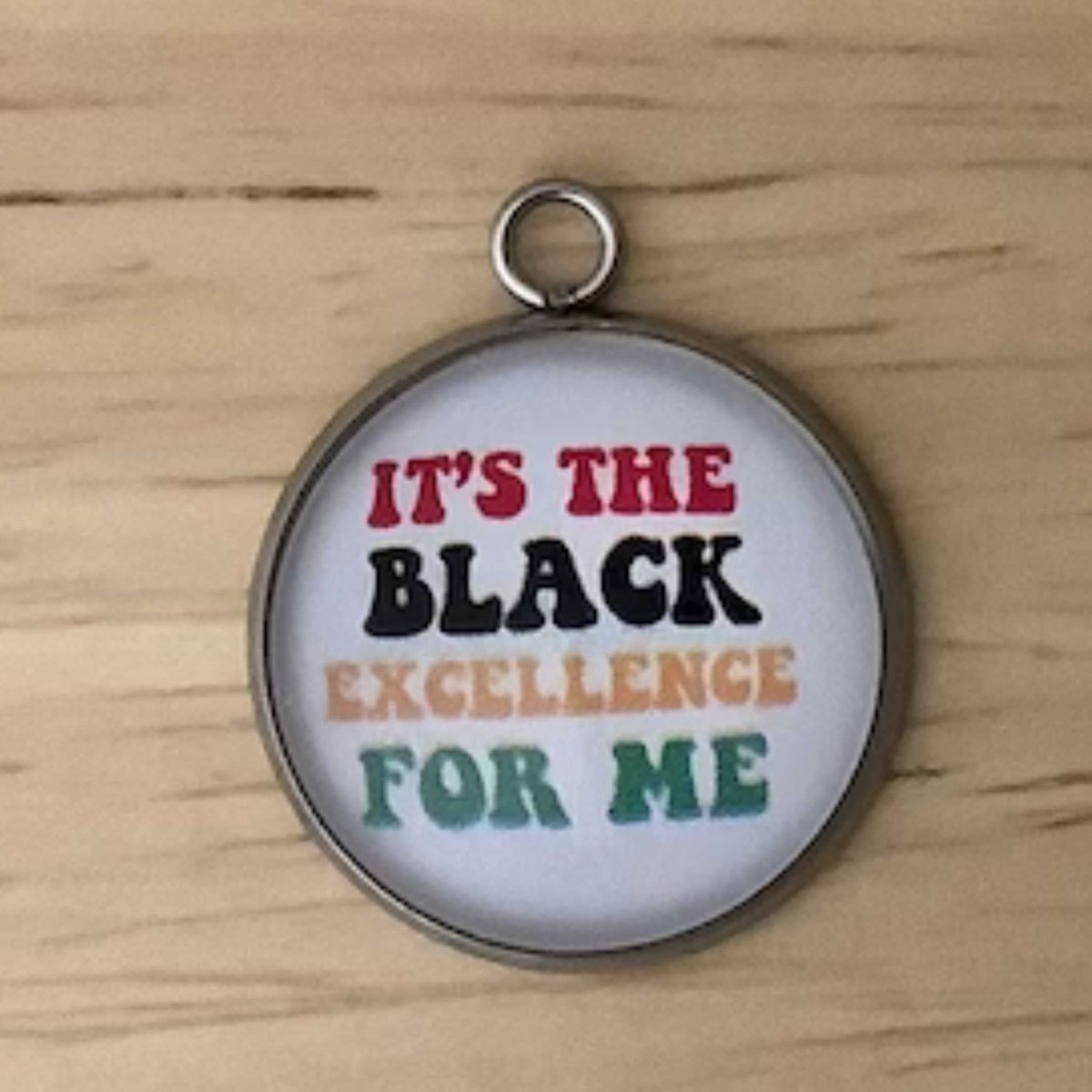 wording ' it's the black excellence for me' in red, black yellow and green