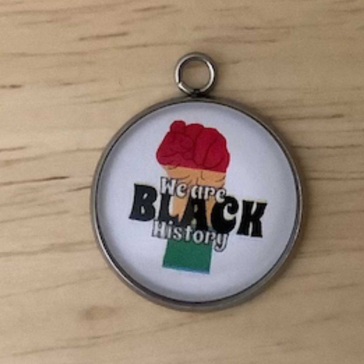 a red, yellow and green fist graphic with the wording 'we are black history'