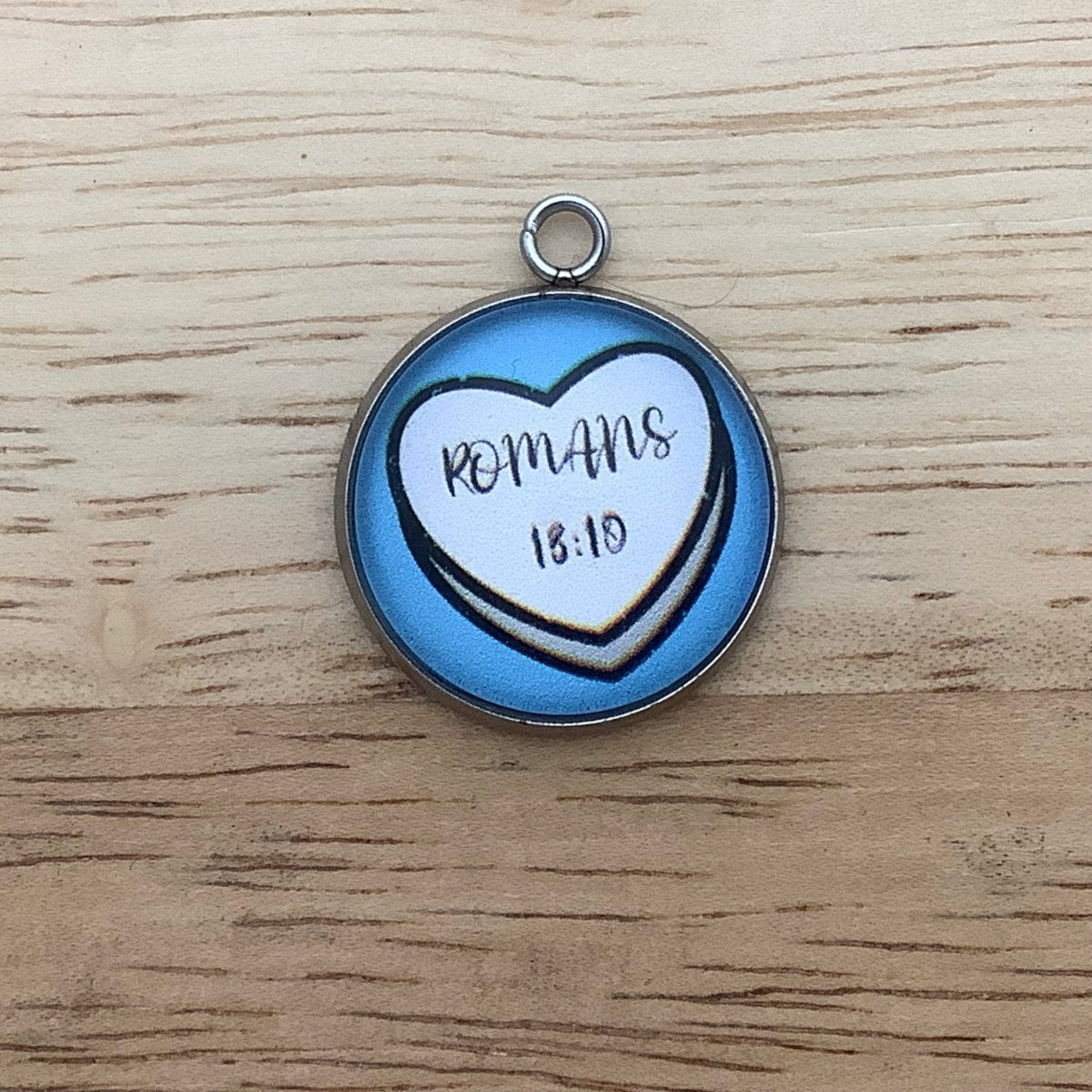 candy heart with Romans 13:10 on it