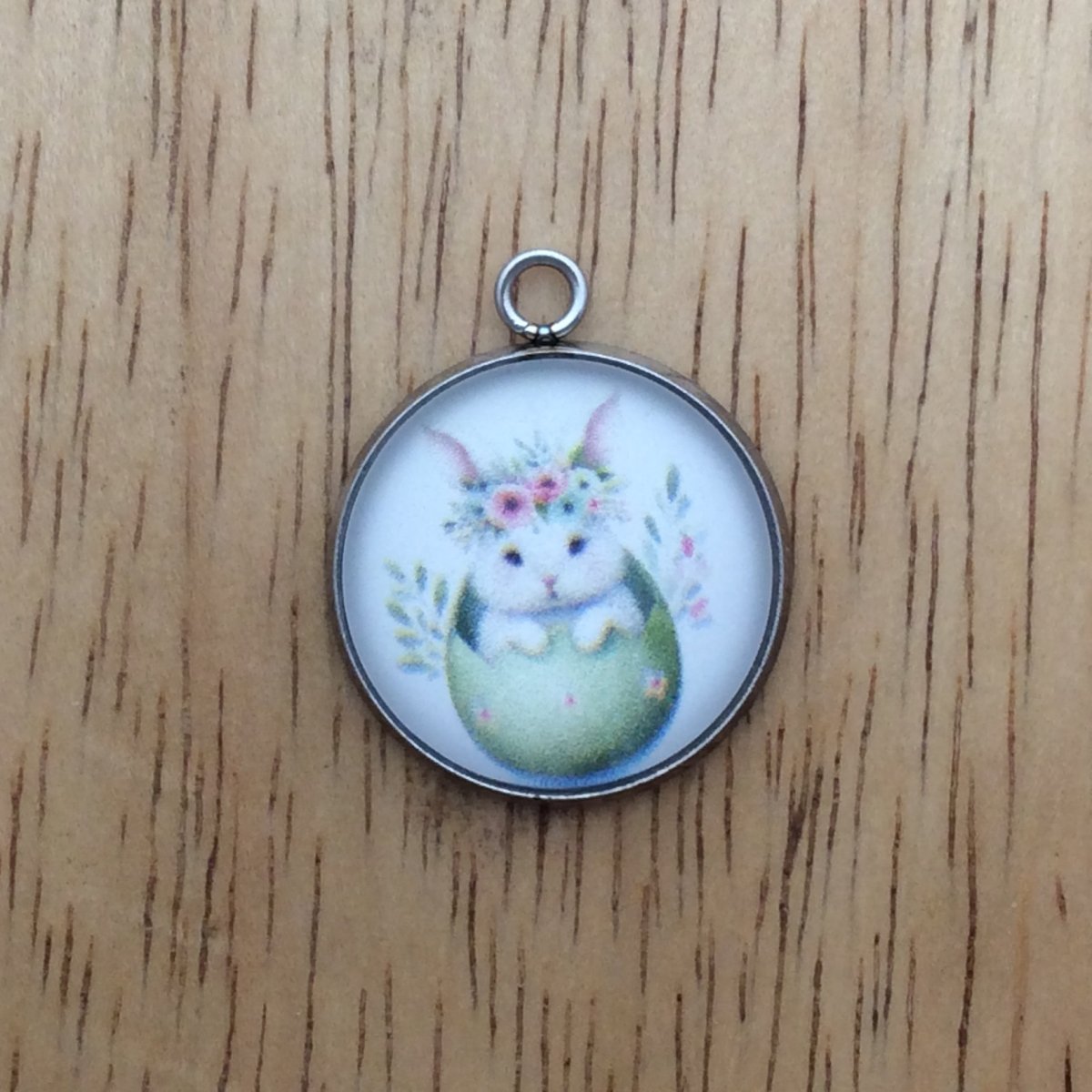 glass cabochon charm with a bunny inside easter egg