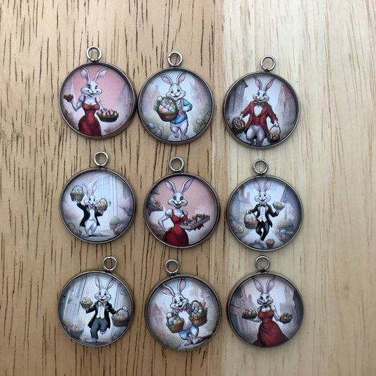 Group of 9 charms featuring the easter bunny dressed in tuxedos and fancy dresses to deliver the easter baskets