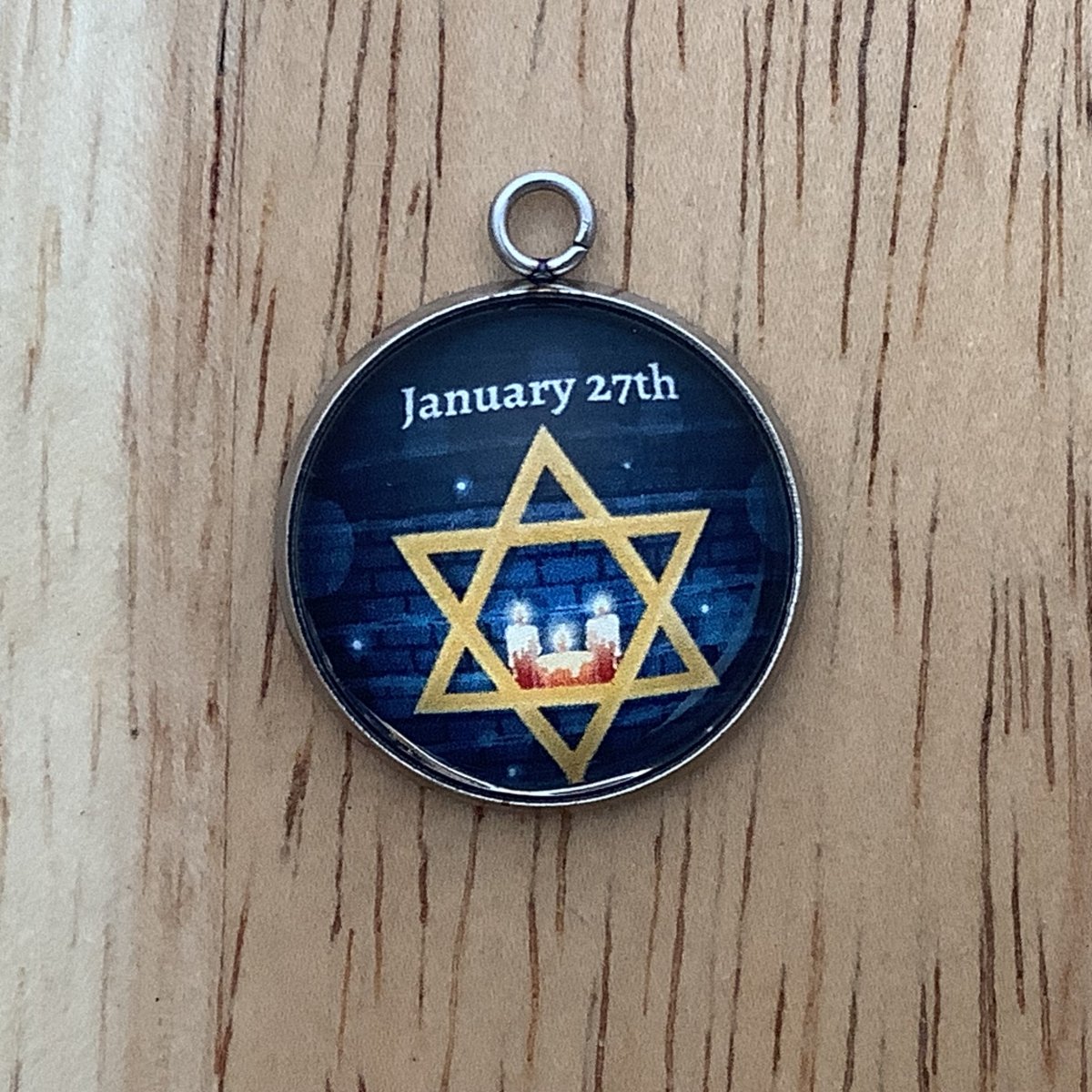 star of david with candles, wording of 'january 27th'