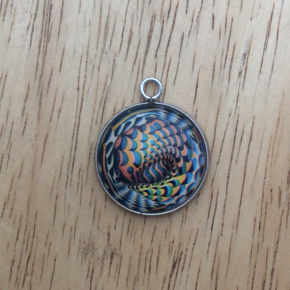 optical illusion glass cabochon charm