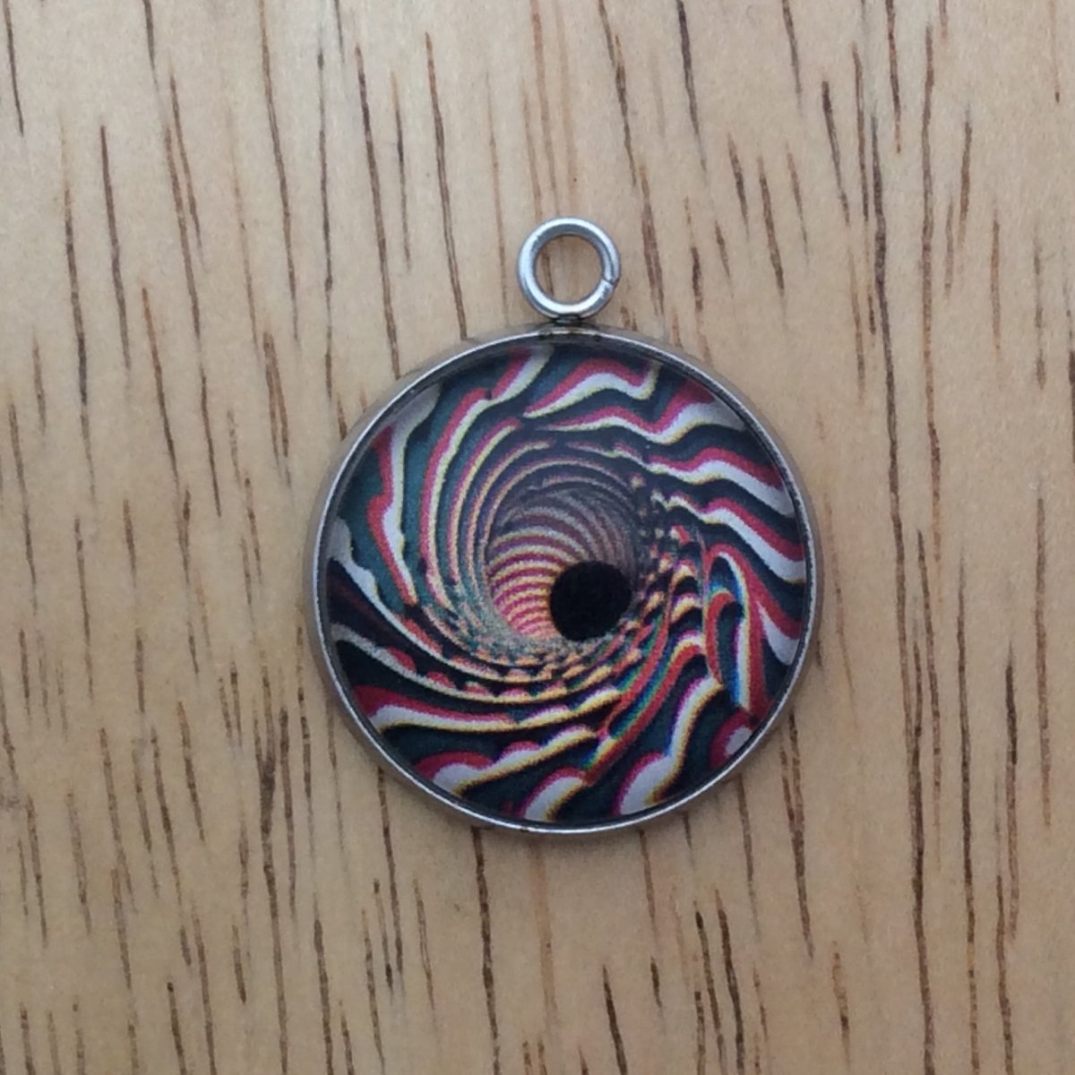 optical illusion glass cabochon charm