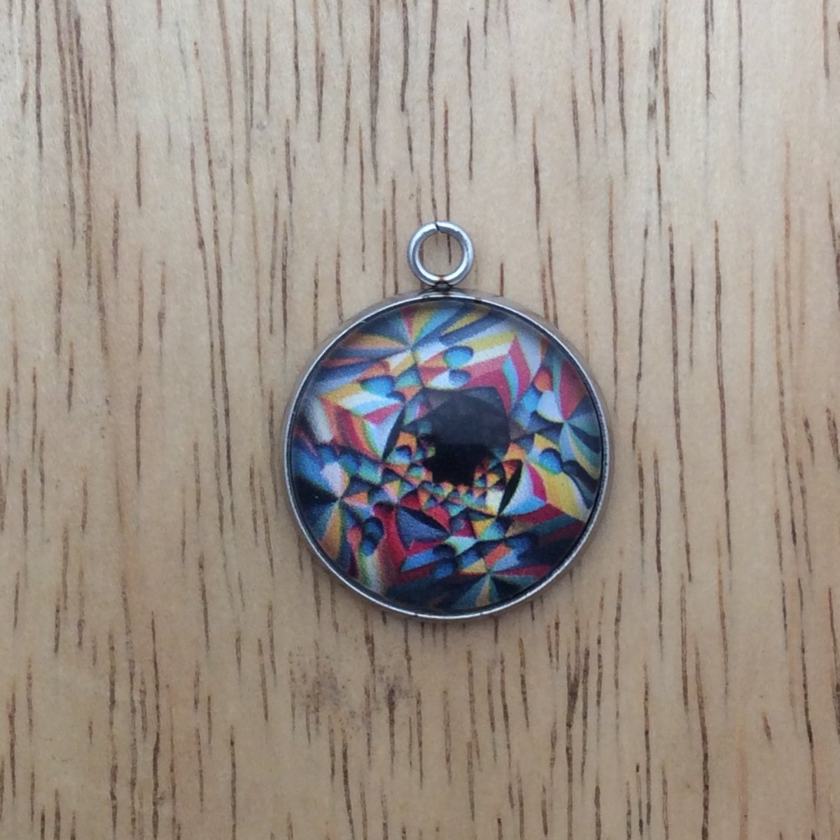 optical illusion glass cabochon charm