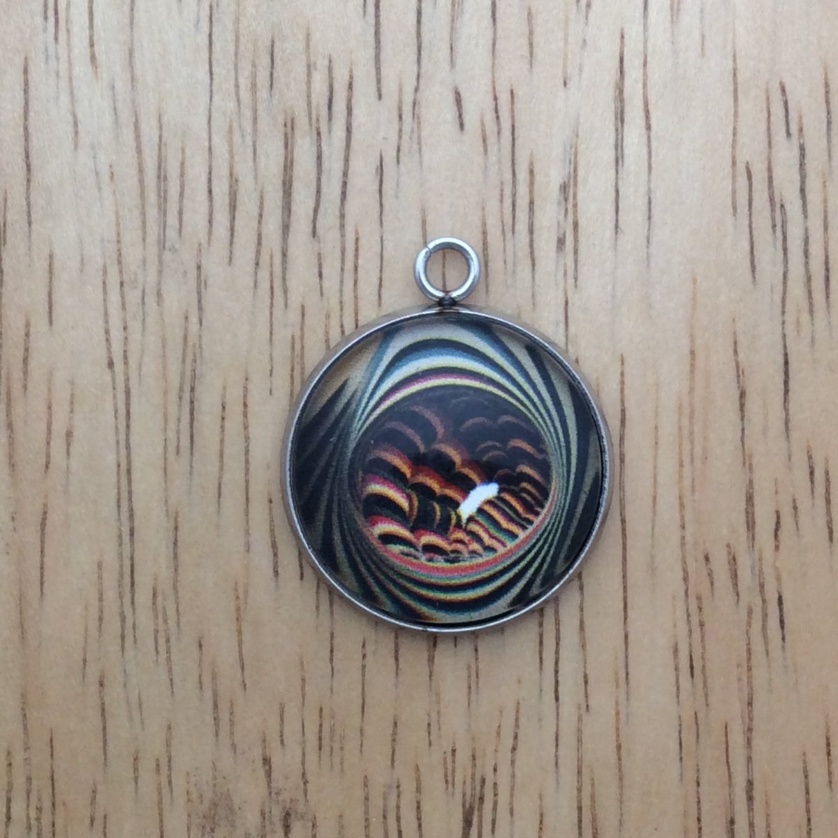 optical illusion glass cabochon charm