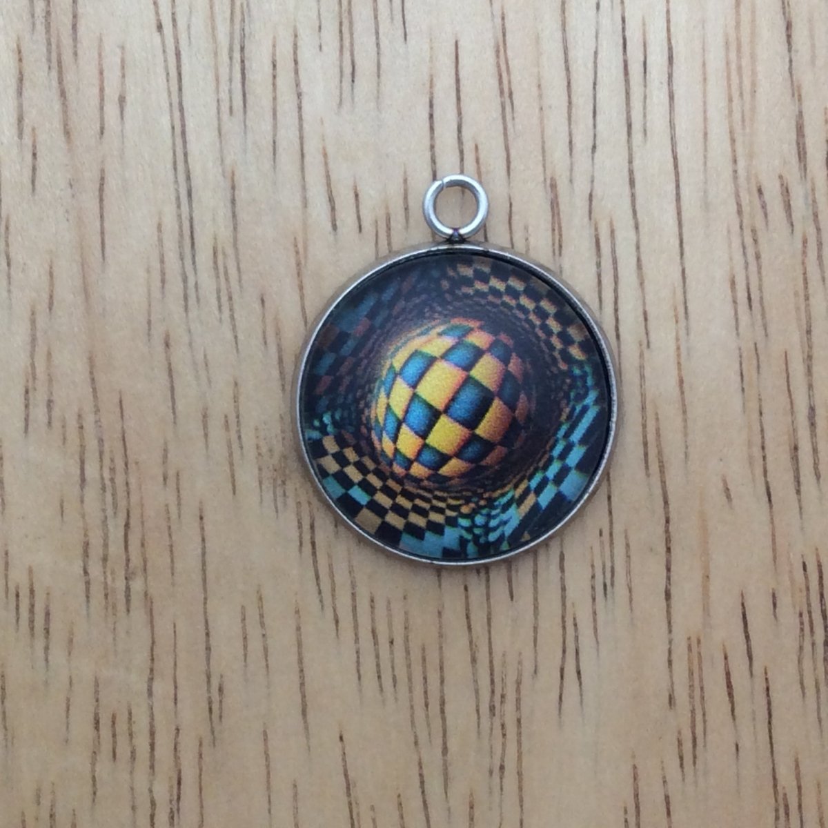 optical illusion glass cabochon charm