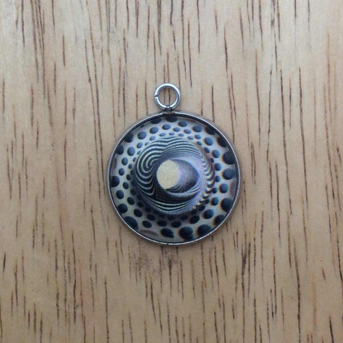 optical illusion glass cabochon charm