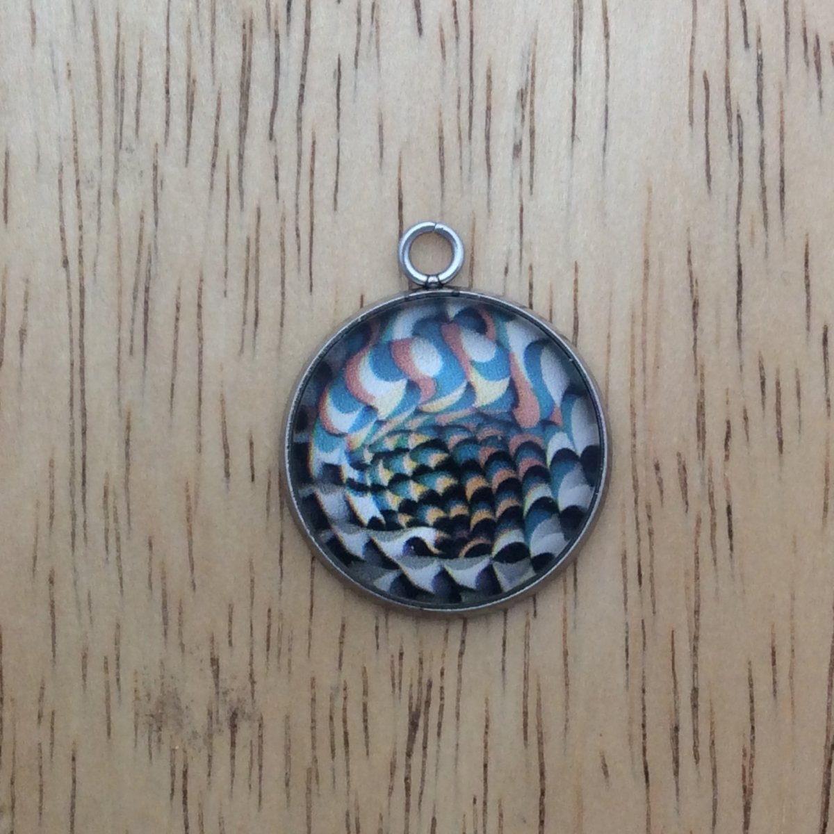 optical illusion glass cabochon charm