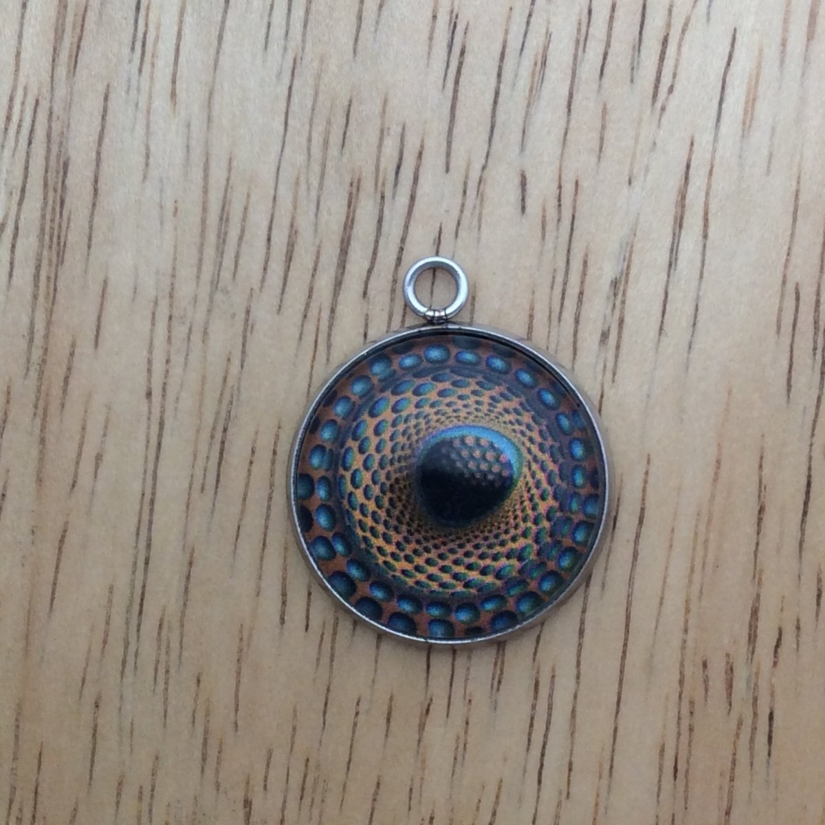 optical illusion glass cabochon charm