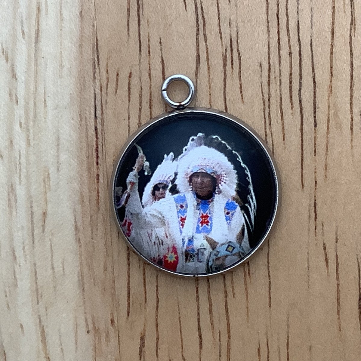 native man in a headdress and a tomahawk