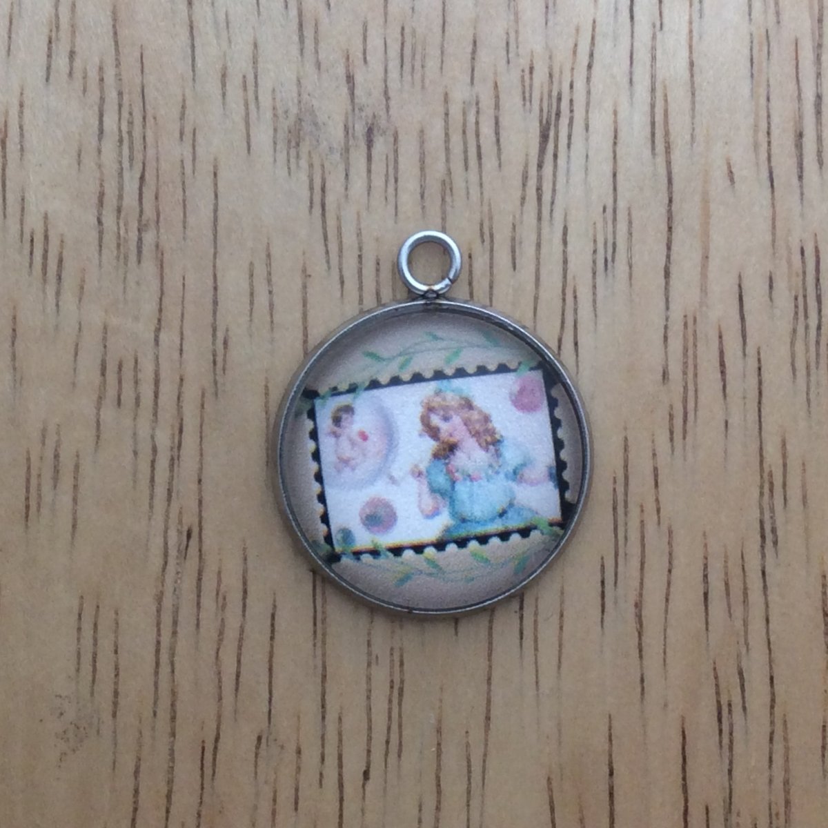 glass cabochon charm with picture of a vintage valentine stamp
