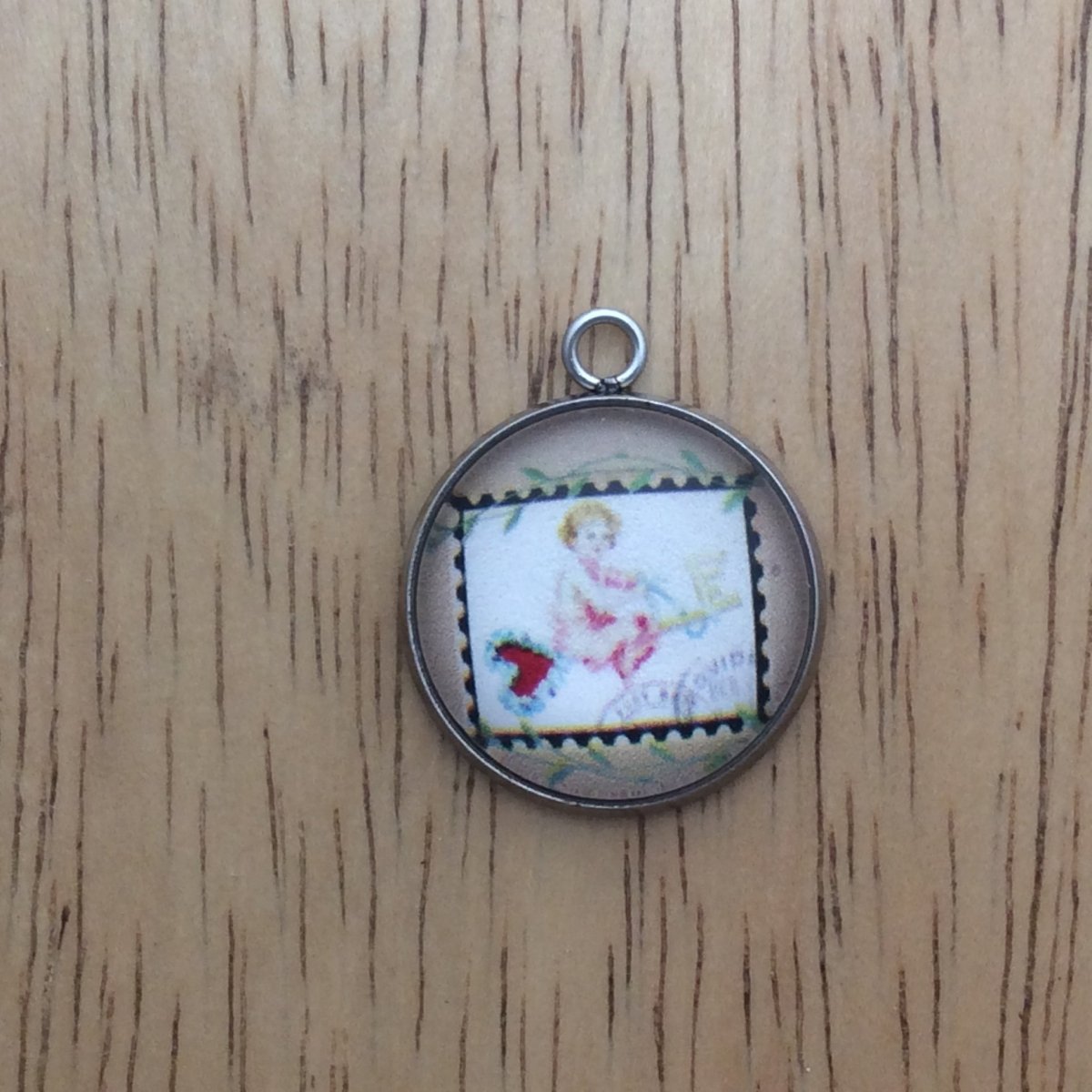 glass cabochon charm with picture of a vintage valentine stamp