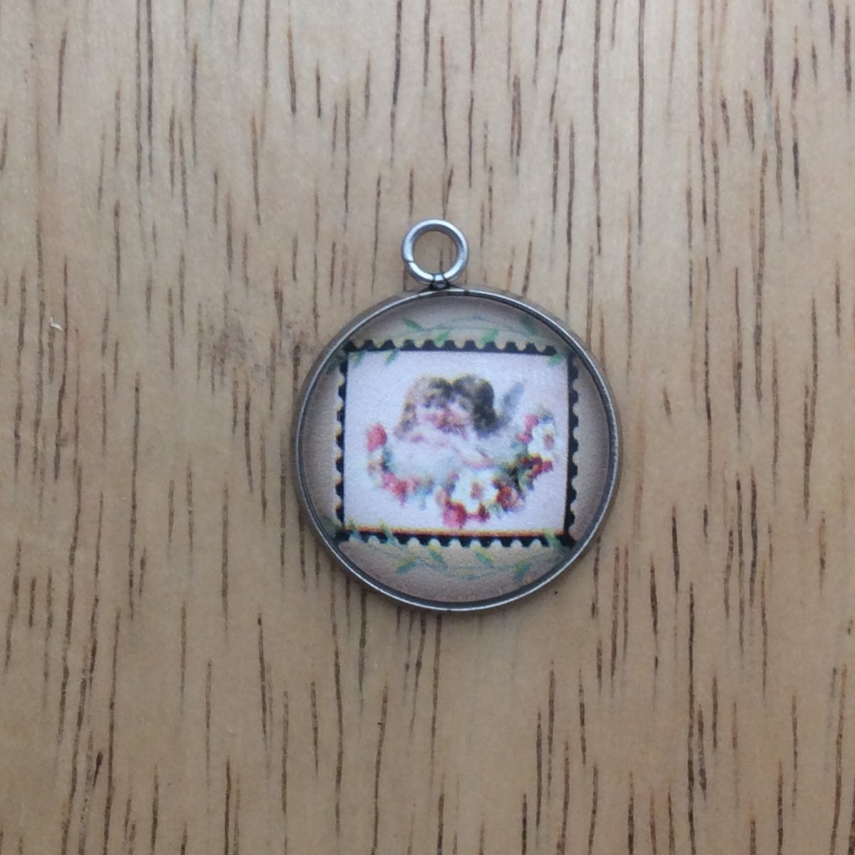 glass cabochon charm with picture of a vintage valentine stamp