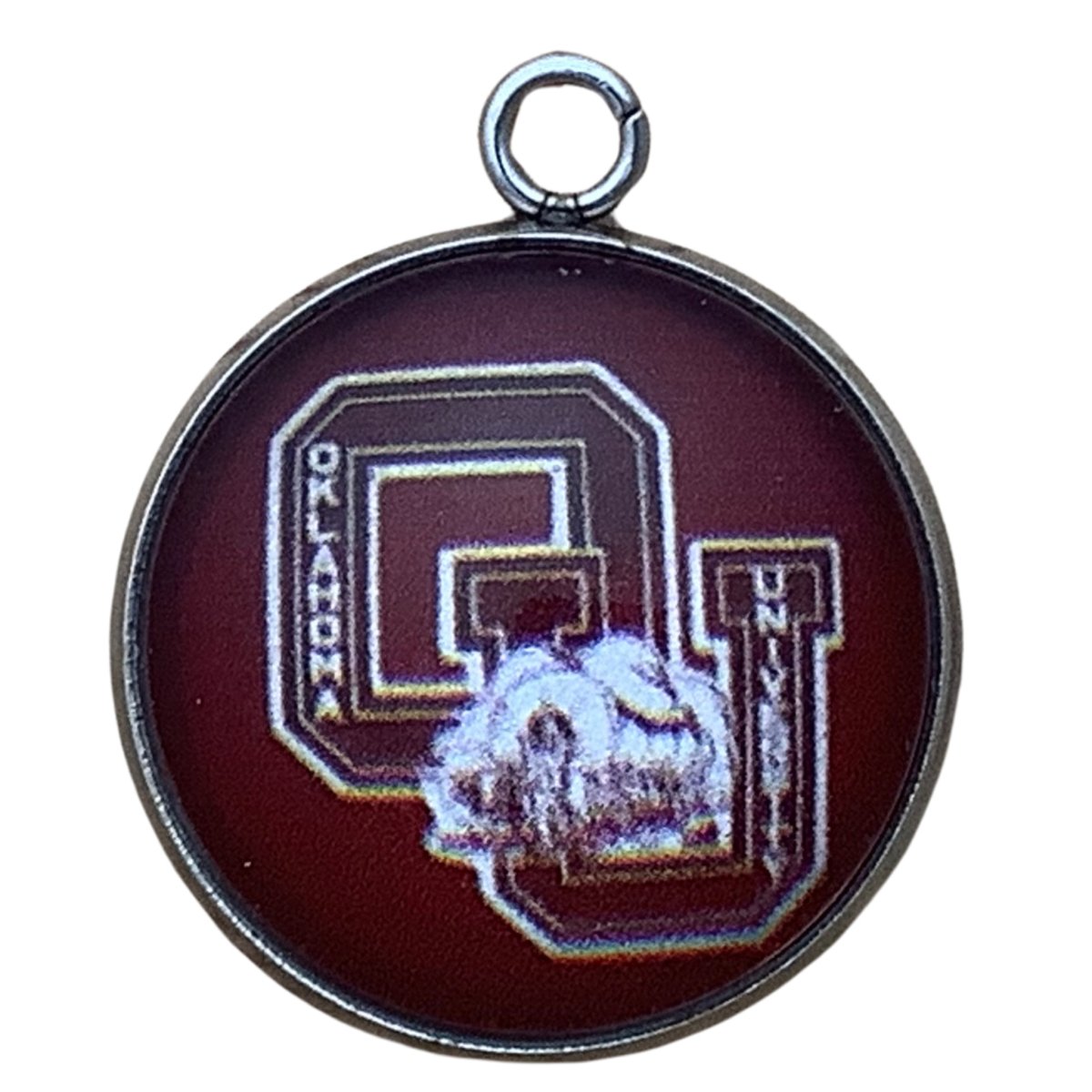 charm with the Oklahoma University OU logo with horse drawn wagon
