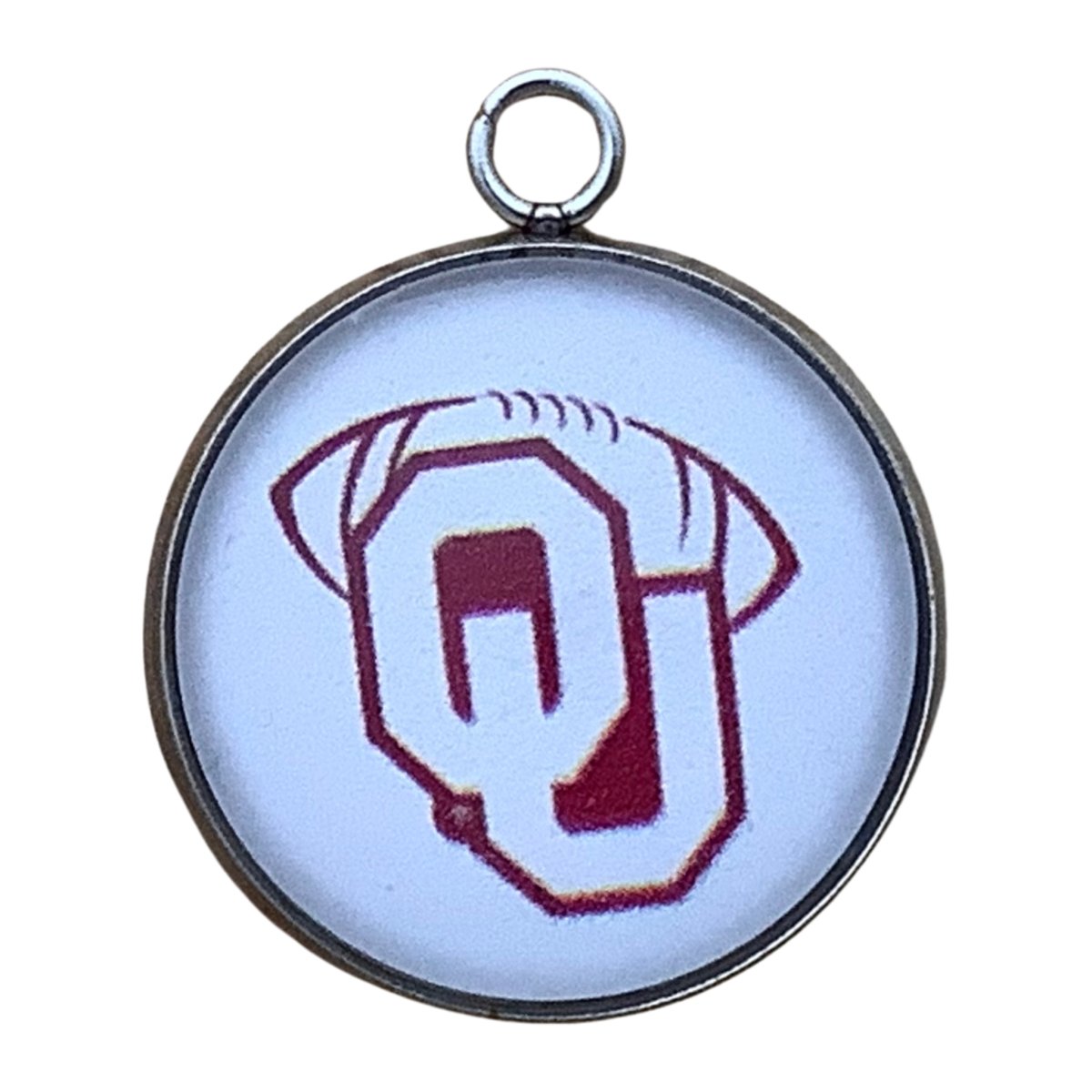 Charm with an OU Logo with a football graphic