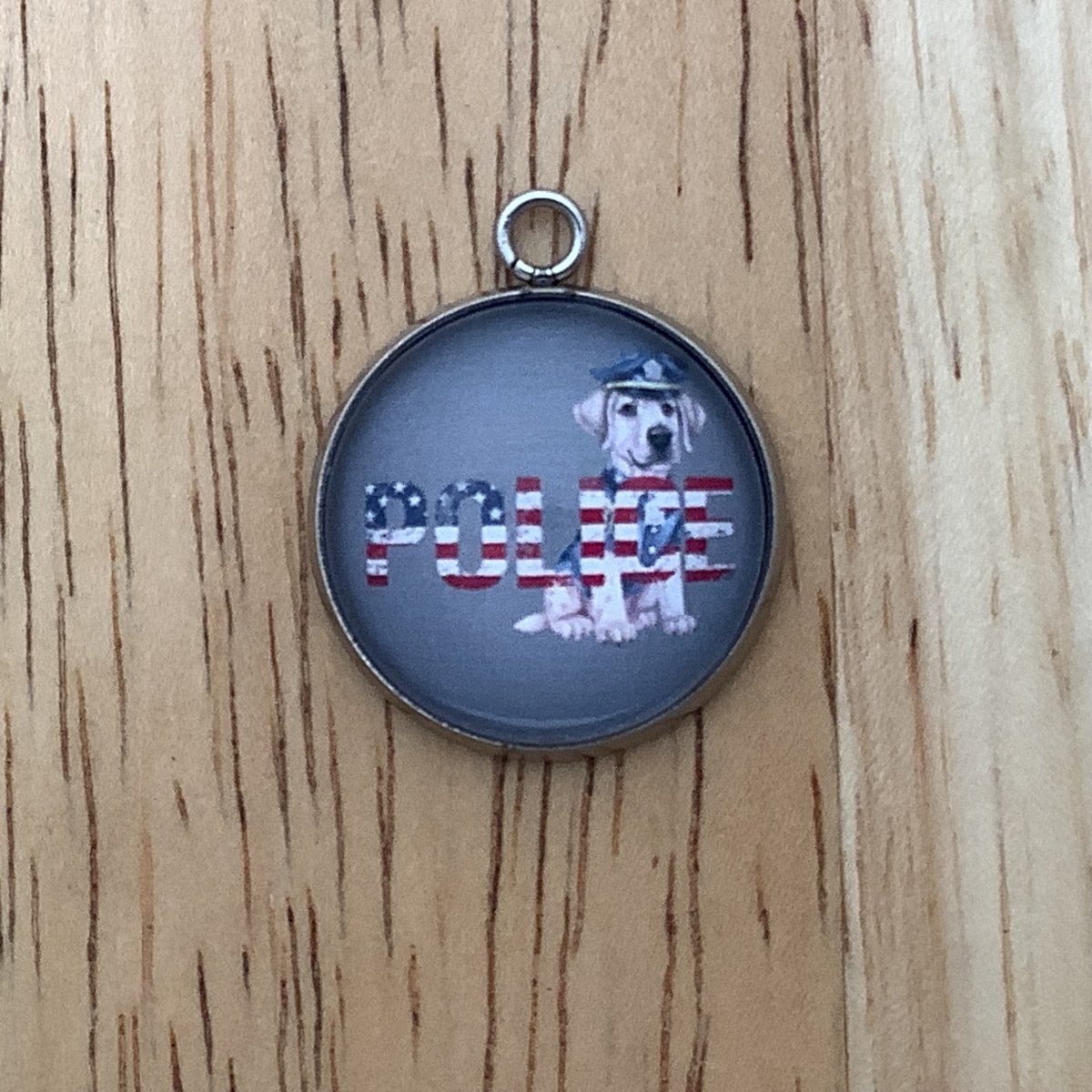 Charm featuring the word Police with a flag design and a Police Dog