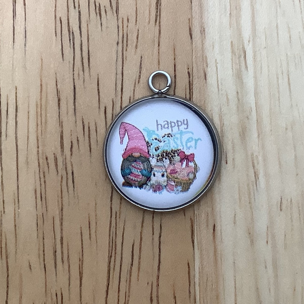 a gnome, an easter egg and a basket with the words Happy Easter