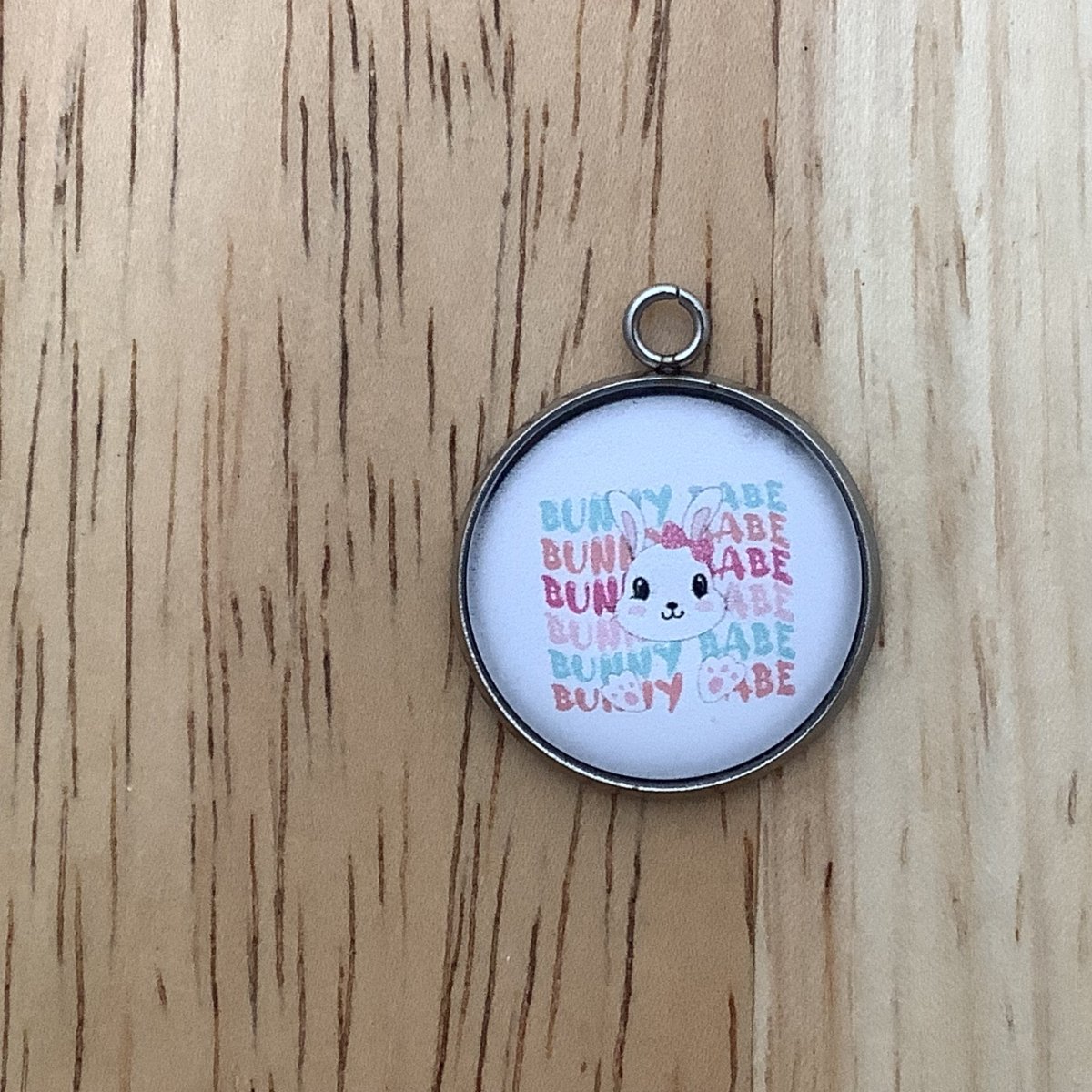 punny face and feet with the words 'bunny babe' written  repeatedly behind