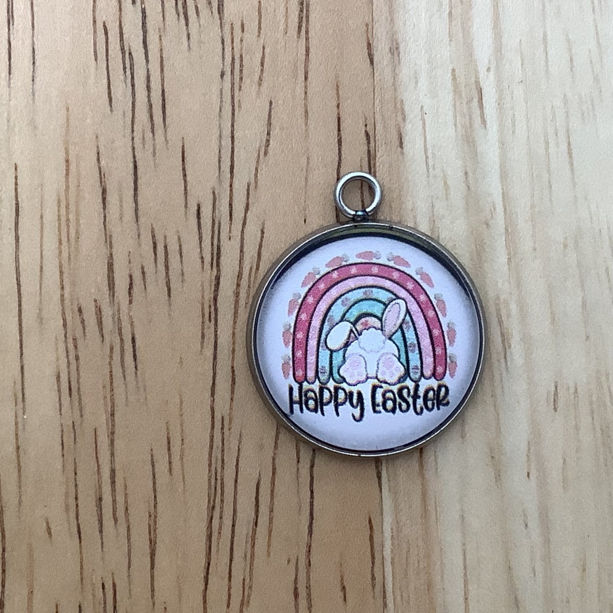 a retro rainbo with a bunny booty sticking out and the words Happy Easter