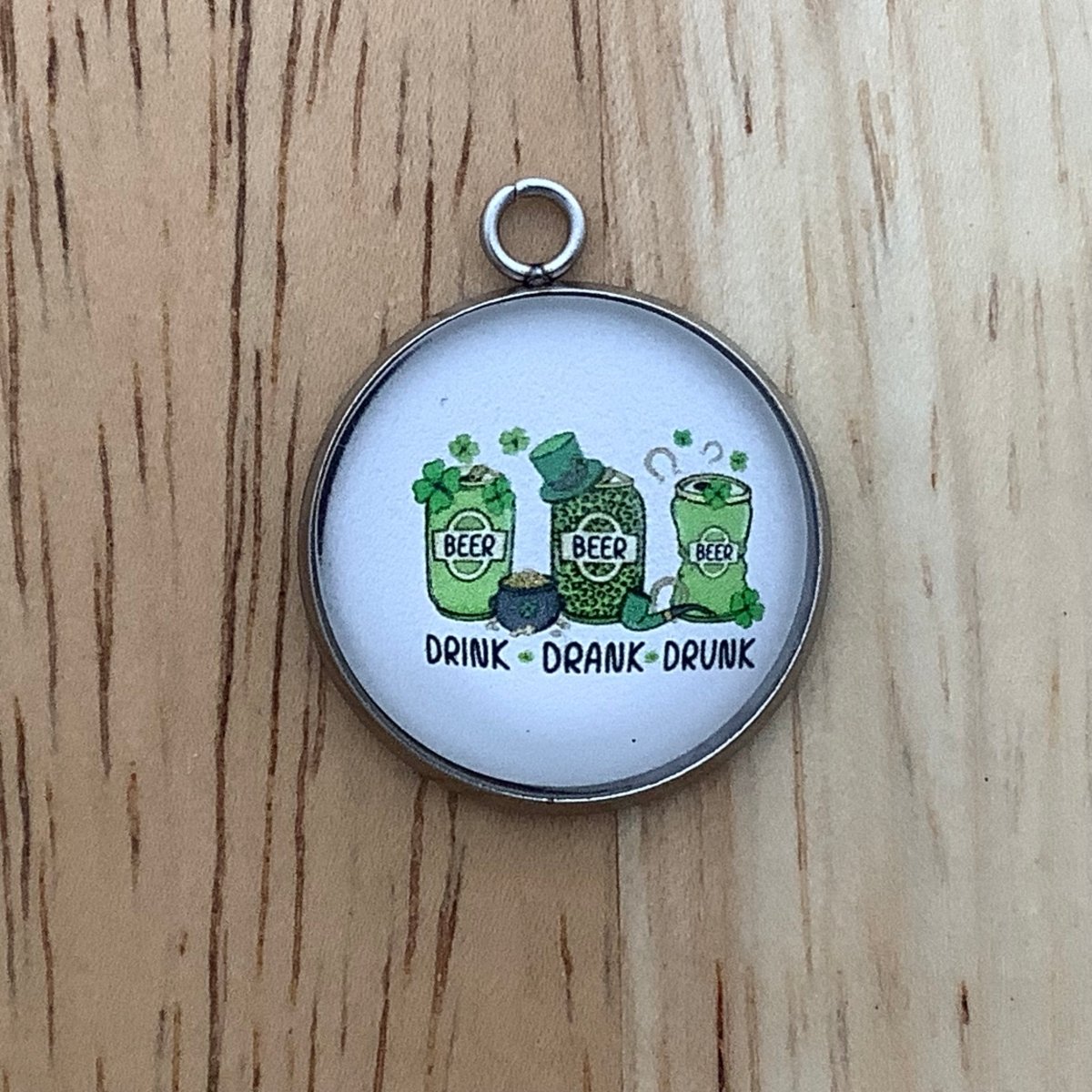 3 Beer cans with the words 'Drink Drank Drunk'