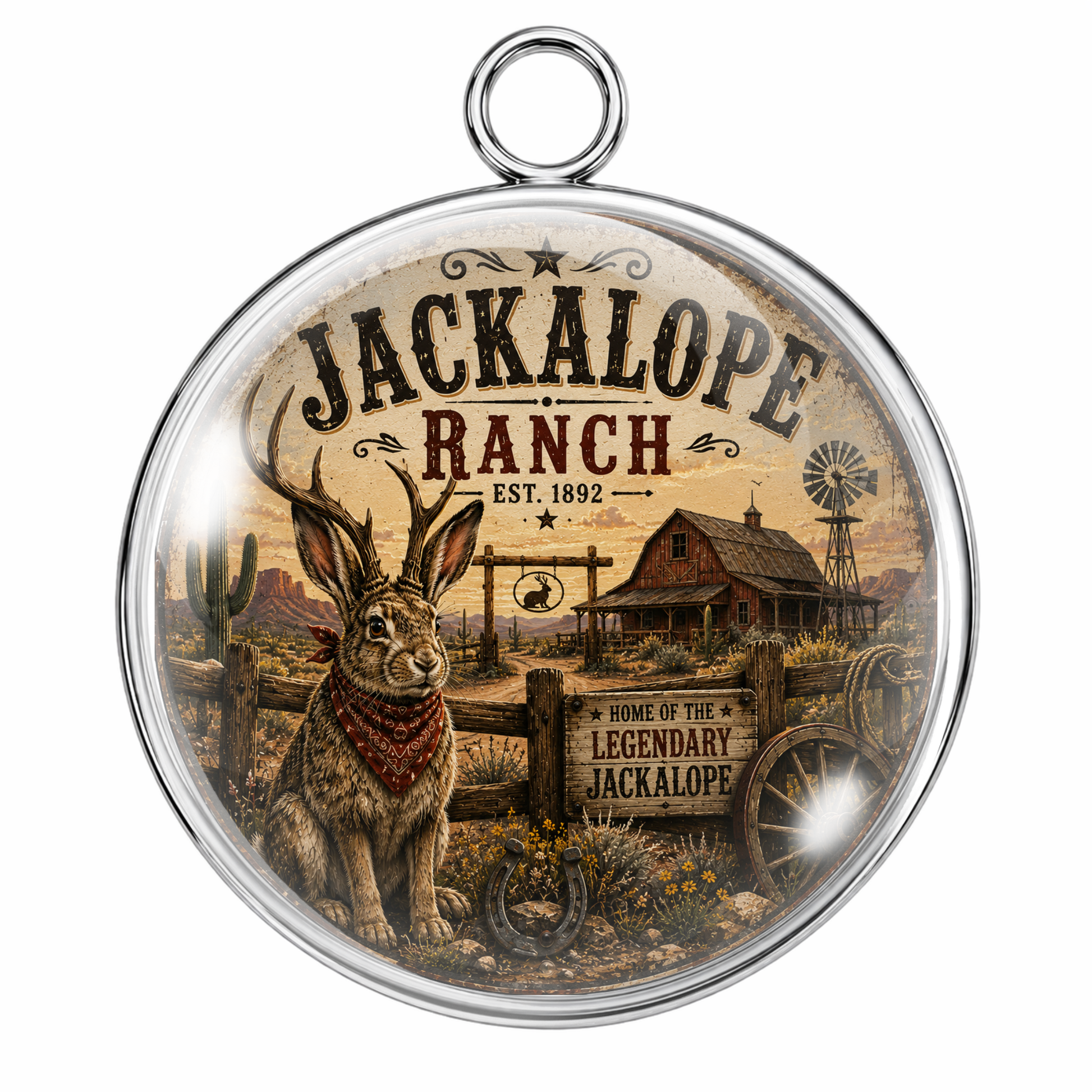 Round cabochon pendant featuring a vintage-style western illustration of Jackalope Ranch with a jackalope rabbit, barn, windmill, and rustic signage, framed in a silver-toned metal border with a hanging loop.