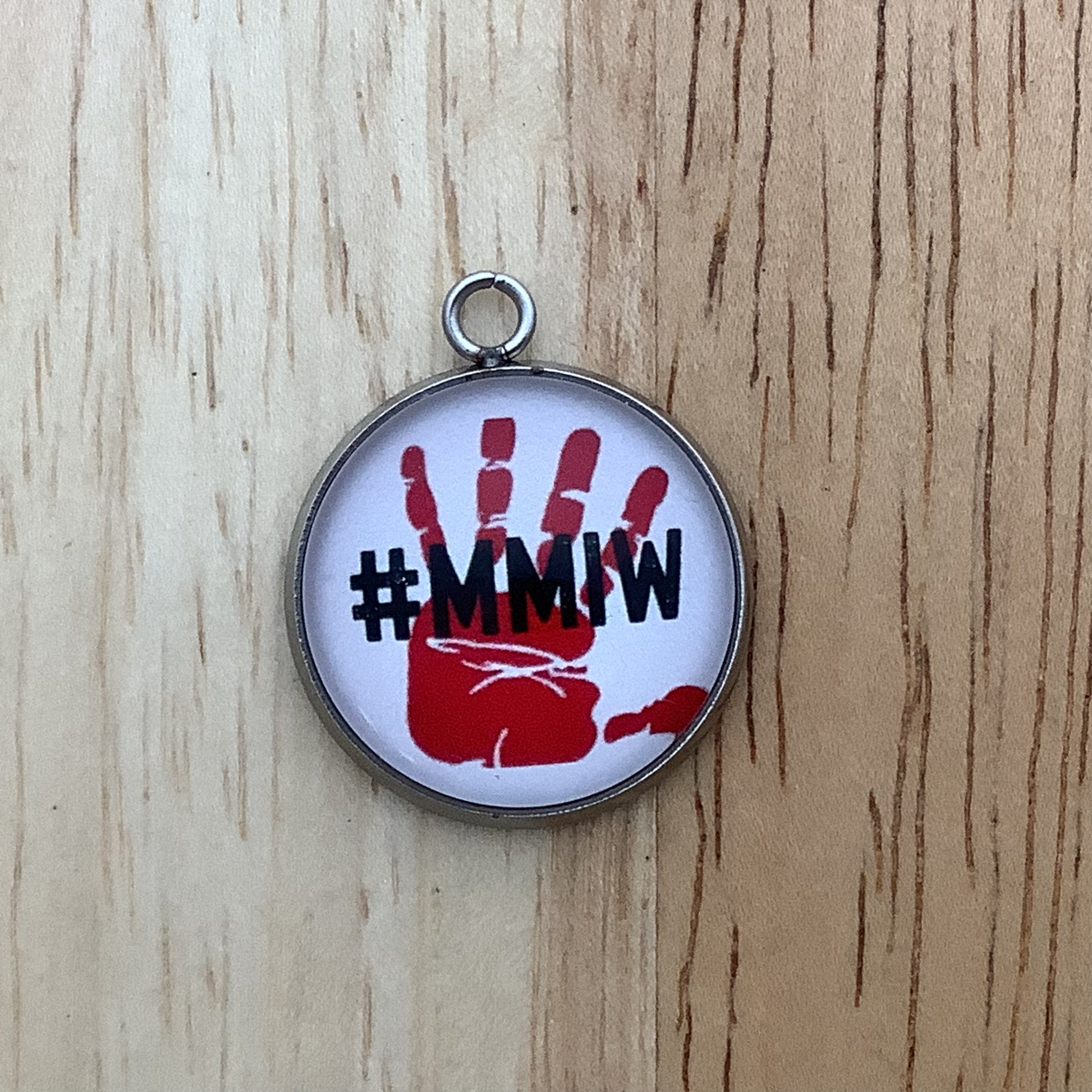 red handprint with #MMIW written in black