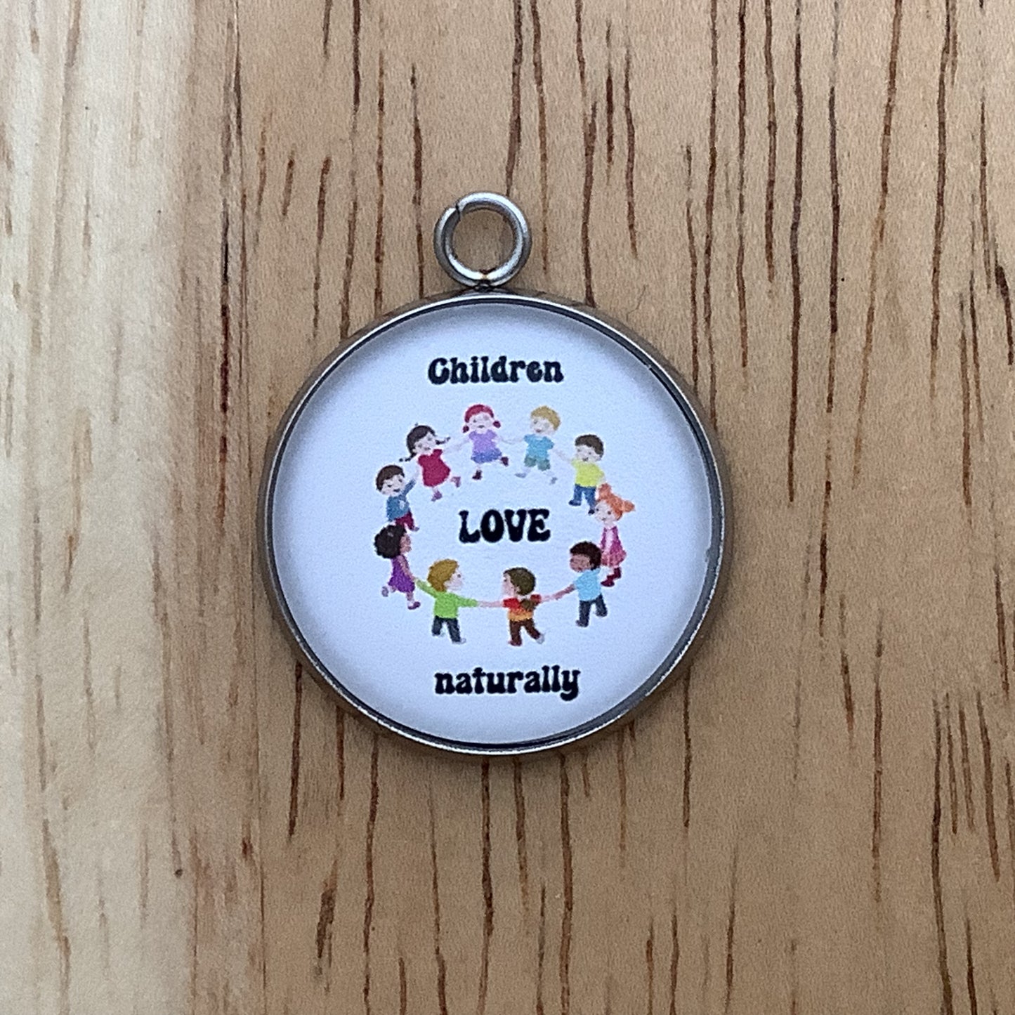 a group of children holding hands in a circle with the words "Children love naturally"