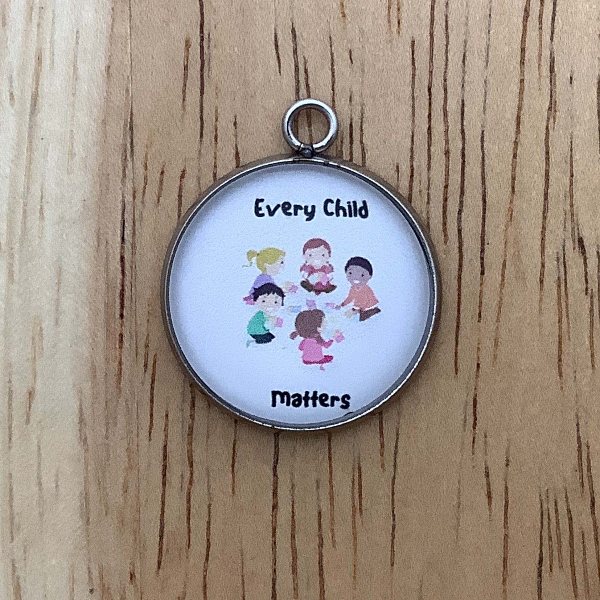 a group of children playing and the words "every child matters"