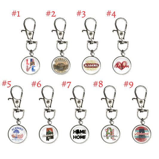 Nine keychains with various designs on a white background