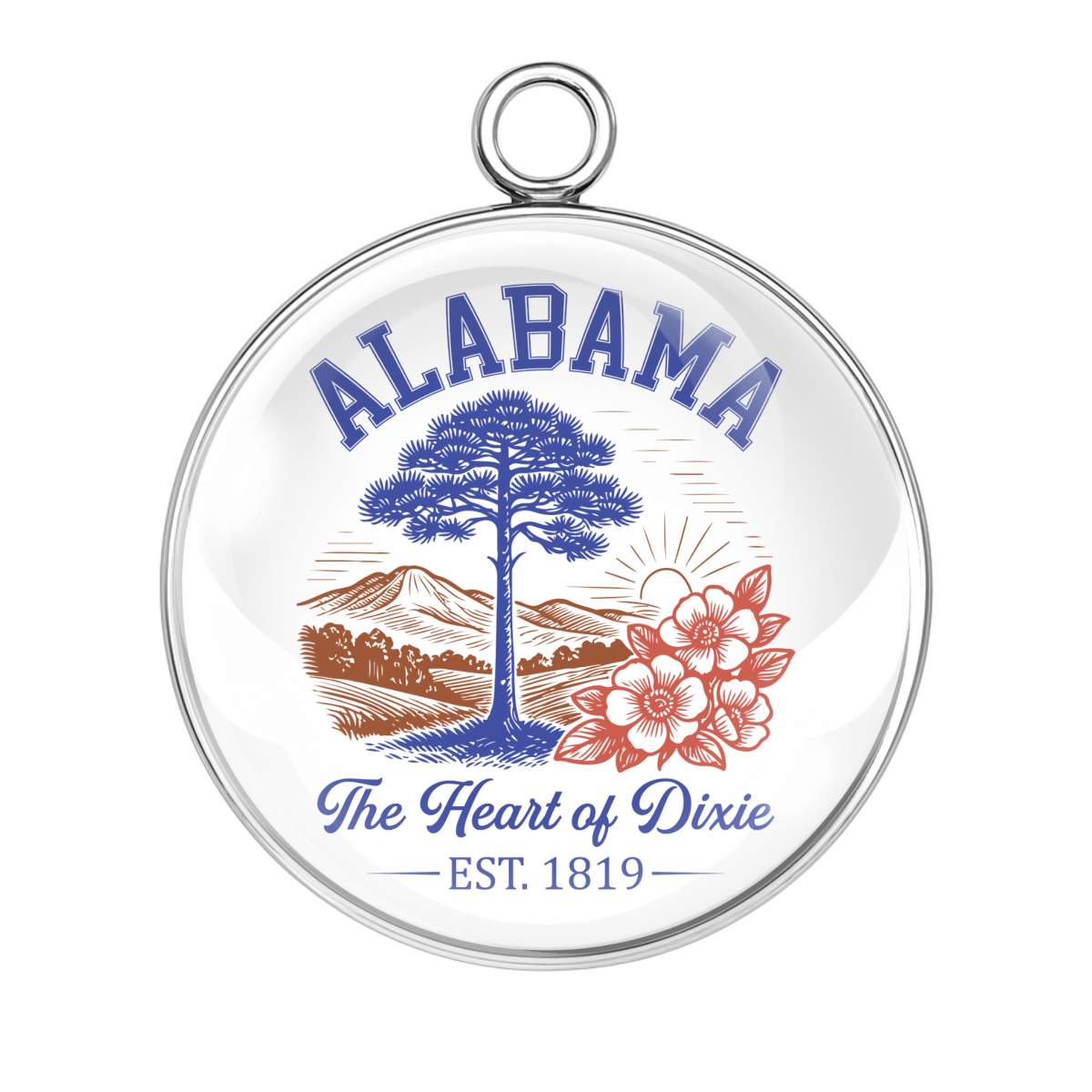 Round pendant with 'Alabama The Heart of Dixie' text and tree, mountain, and flower design on a white background.