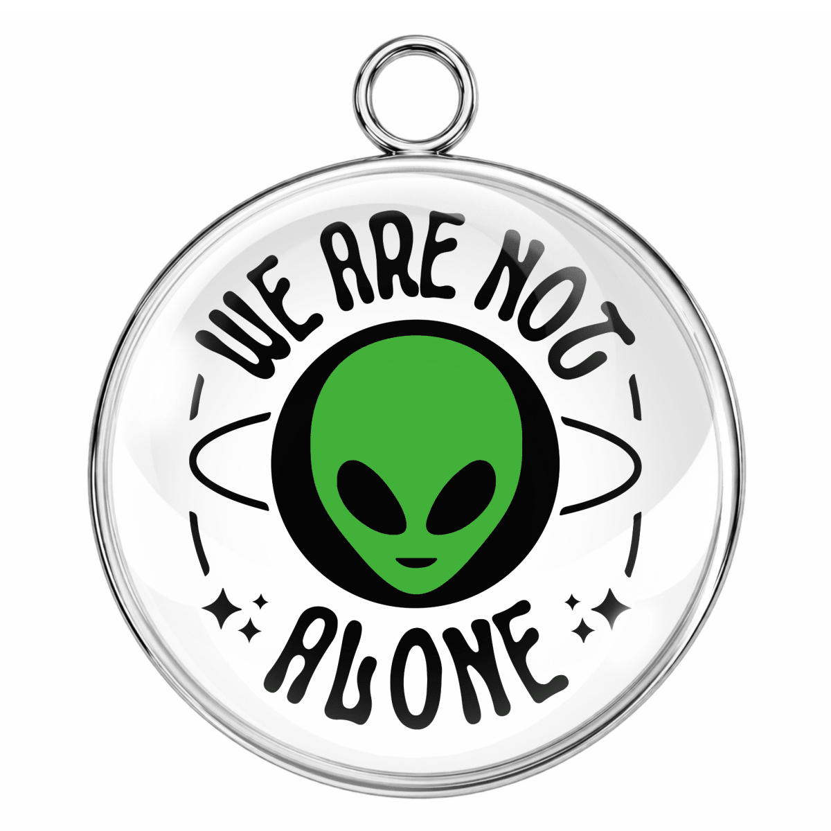 Circular pendant with green alien face and 'We Are Not Alone' text on a white background