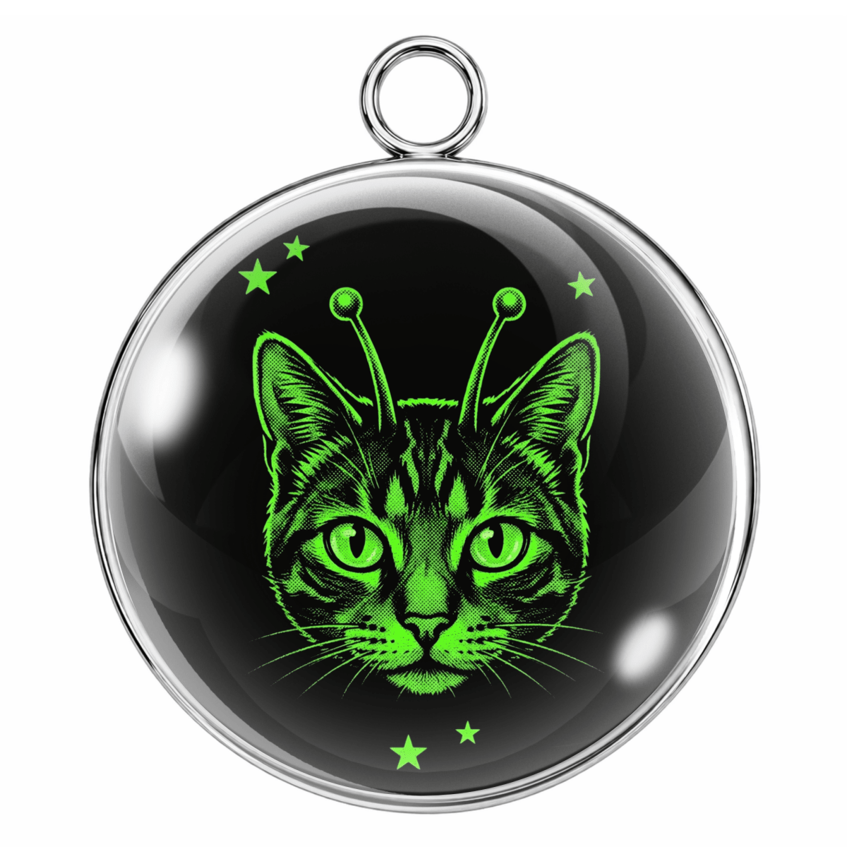 Circular pendant with a cat design featuring green eyes and alien-like antennae on a black background.