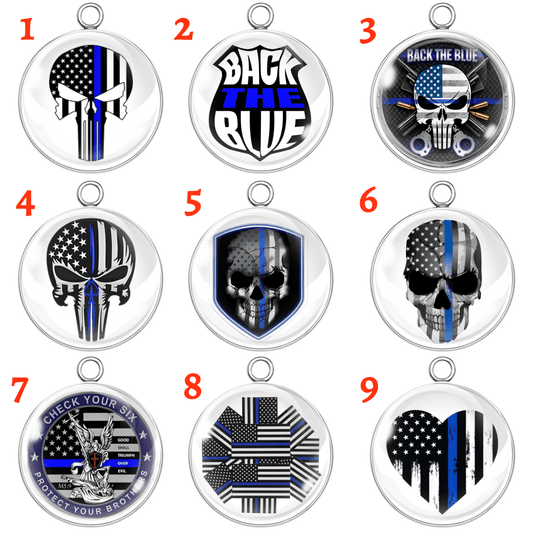 Collection of 'Back the Blue' themed pendants with various designs on a white background.