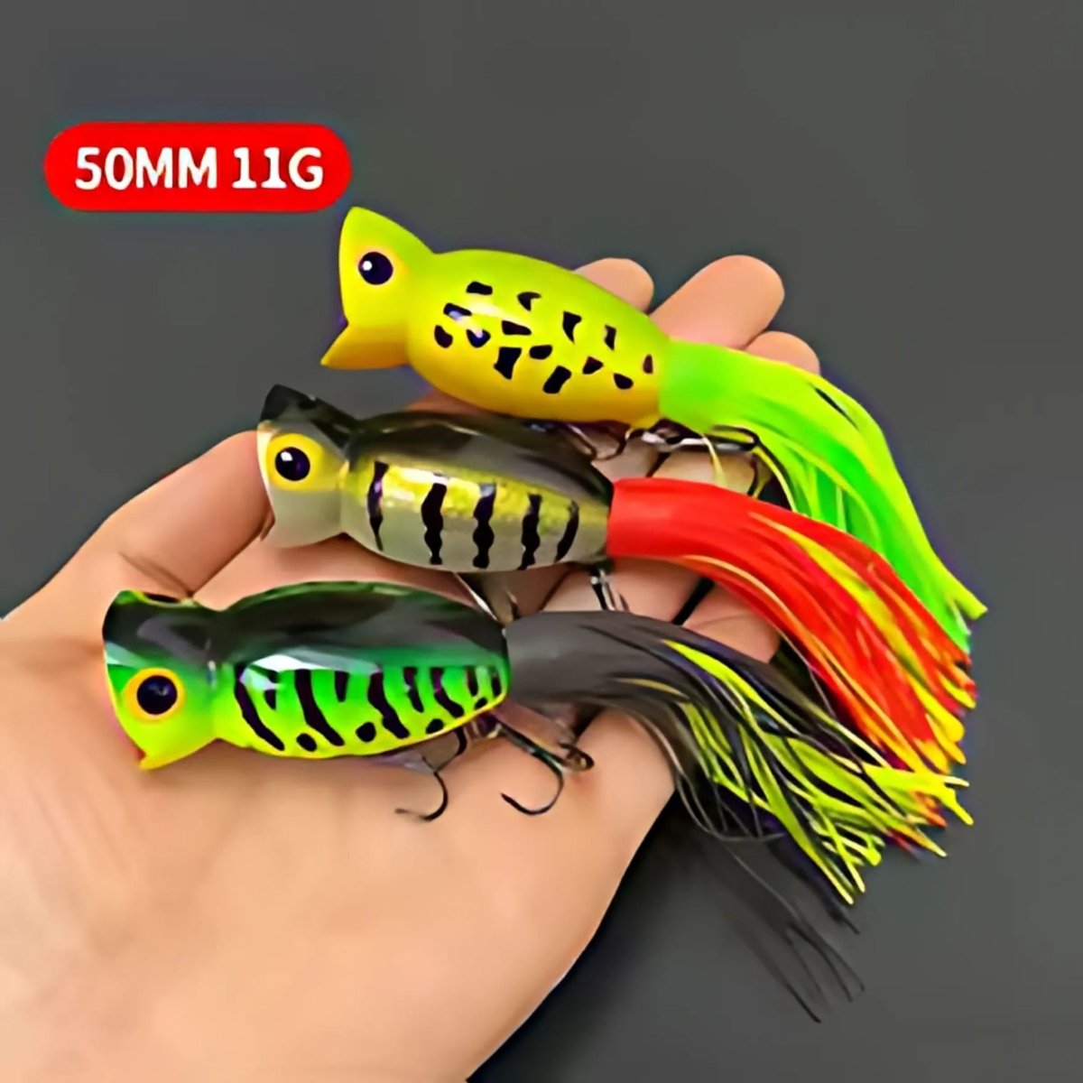 three Hula Popper fishing lures