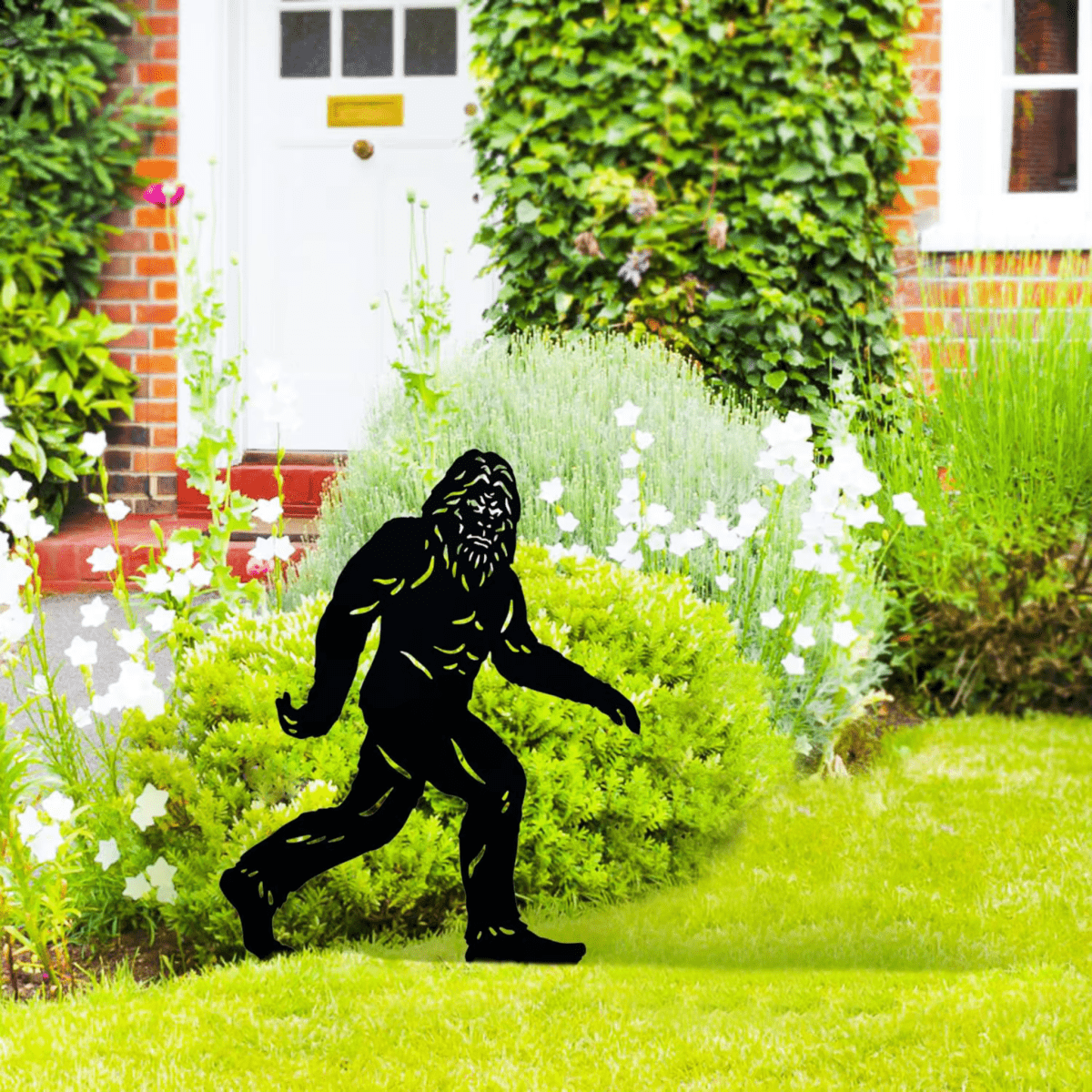picture of bigfoot yard stake in a porch garden