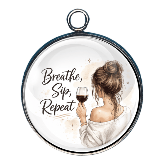 Charm of a woman holding a glass of wine and text 'Breathe, Sip, Repeat'.
