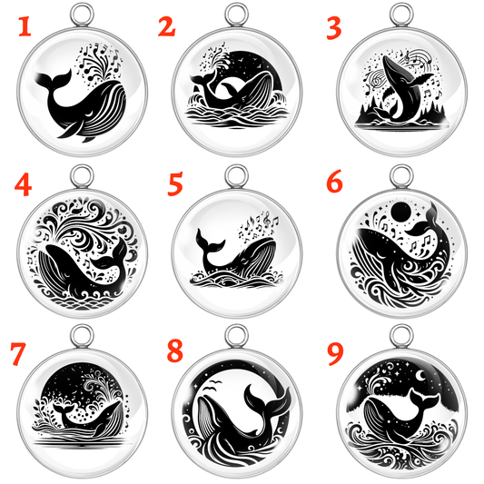 A 3x3 grid of nine black-and-white celestial whale glass cabochon charms, each featuring unique illustrations of whales swimming through waves, stars, moons, and musical notes.