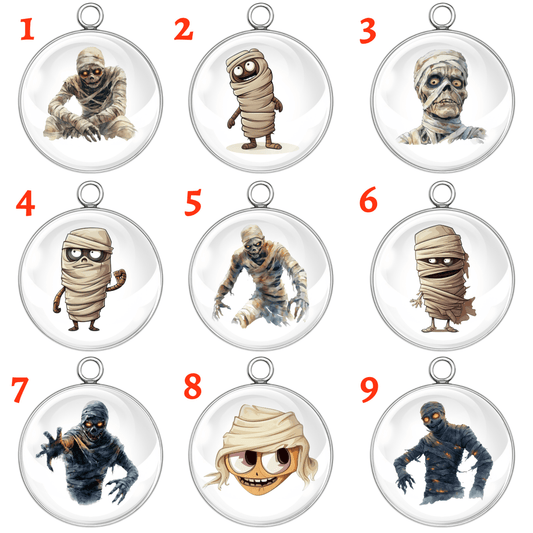 "Set of 9 creepy mummy Halloween charms with numbered designs"