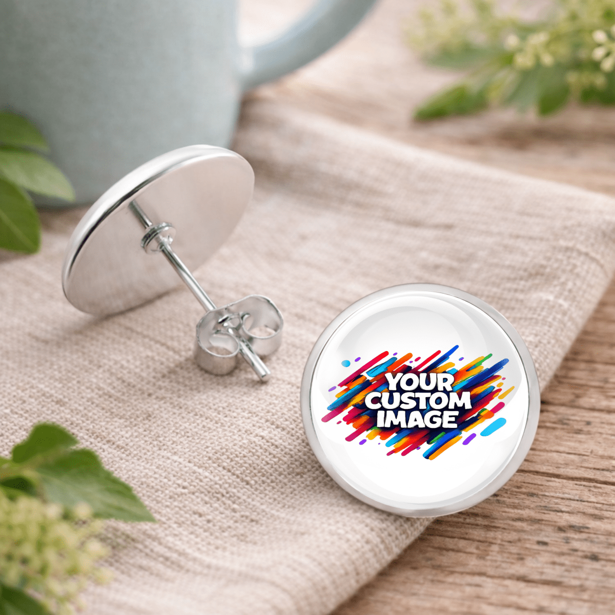 Earring with customizable image design on a wooden surface