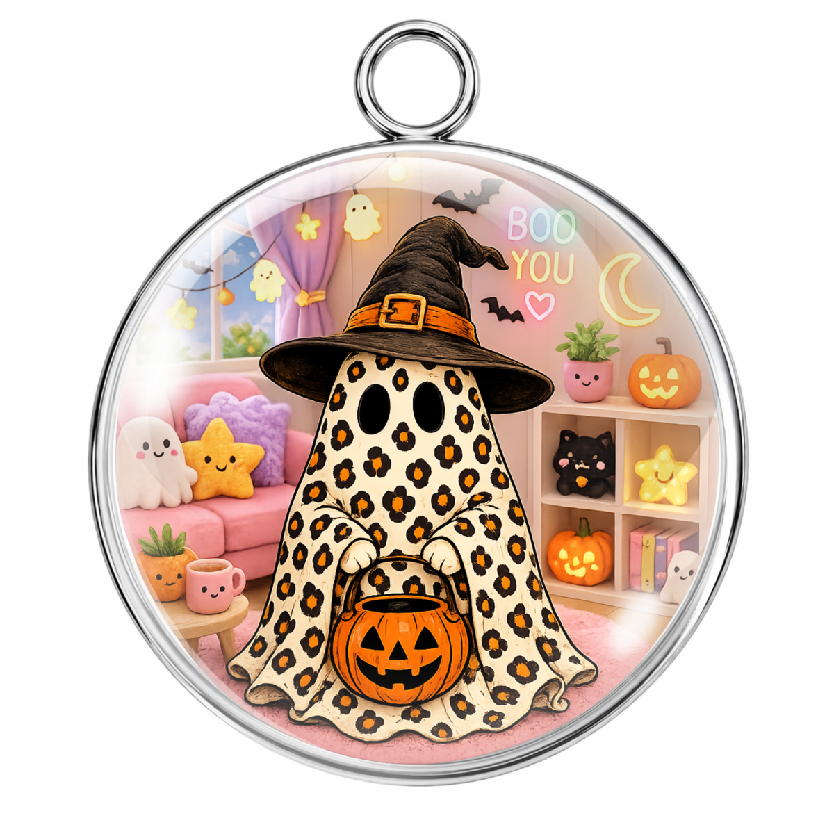 A round silver pendant with a hanging loop, featuring a colorful cartoon ghost Halloween design with a leopard print cloak, witch hat, and jack-o'-lantern, shown on a plain white background.