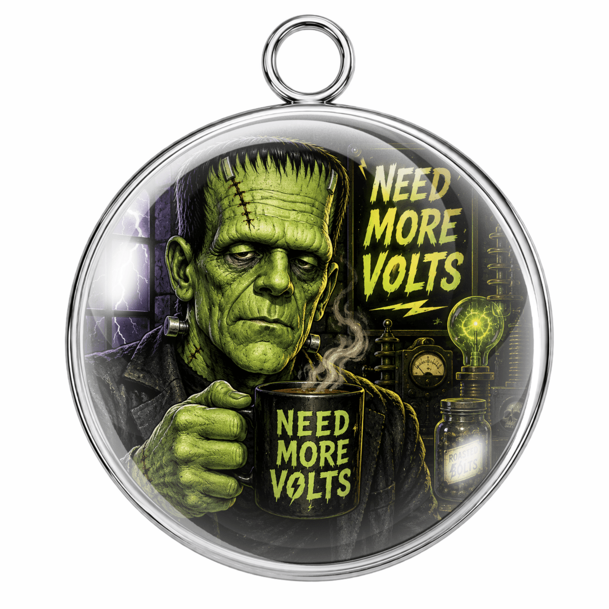 A round silver-toned pendant featuring a graphic of Frankenstein's monster holding a mug that says 'NEED MORE VOLTS' next to matching text, shown on a plain white background.