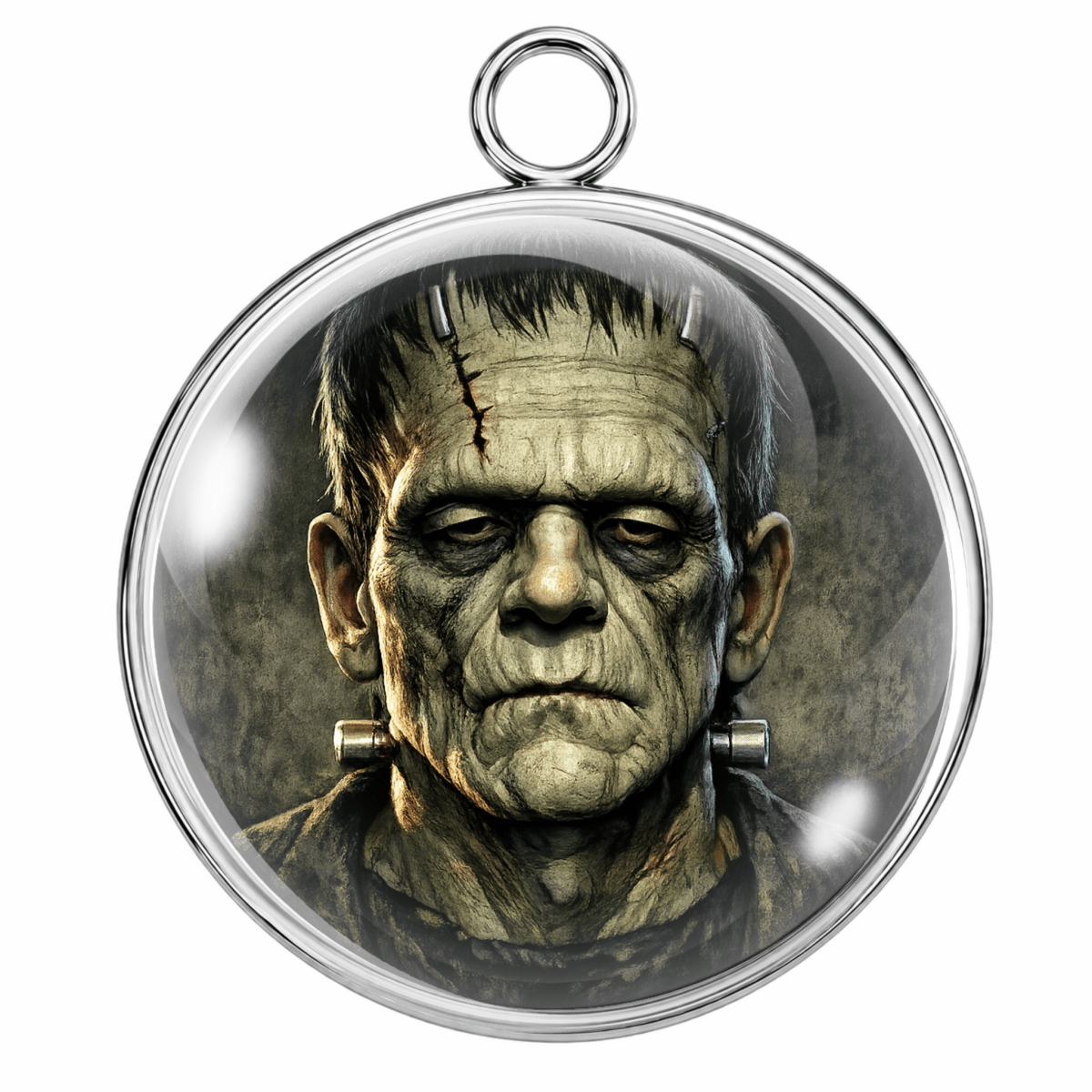 A round silver pendant featuring a detailed graphic of the character Frankenstein with a glass dome cover, shown on a plain white background.